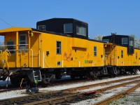 A pair of ETR cabooses no longer in use sit idle in the Windsor ETR yard.