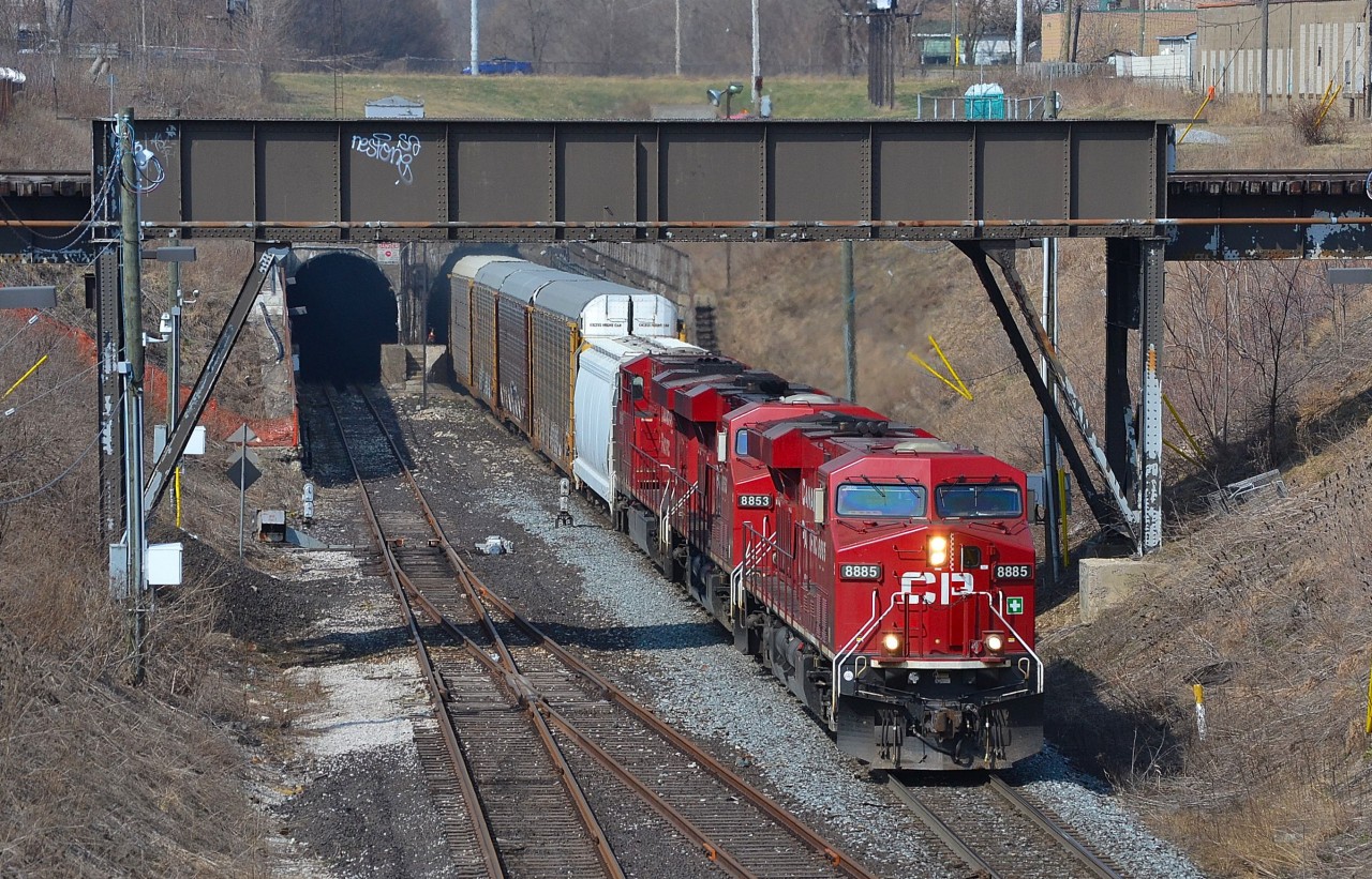 CP 244 led by a trio of GEs, emerges from the Detroit Windsor rail tunnel.