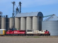 CP 240 led by SOOs 6036 & 6046 rolls eastbound past the grain elevator at Haycroft.