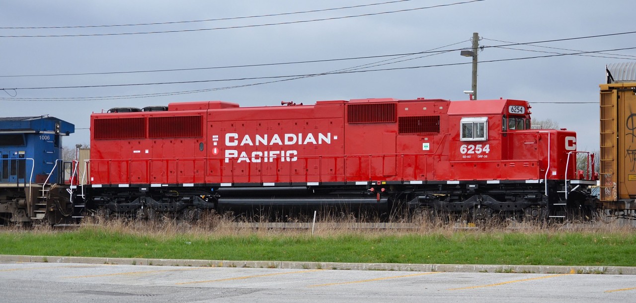 On it\'s maiden voyage from Montreal, freshly rebuilt and repainted CP 6254 (ex SOO 6054) trails on CP 235 as it heads for the Windsor-Detroit rail tunnel