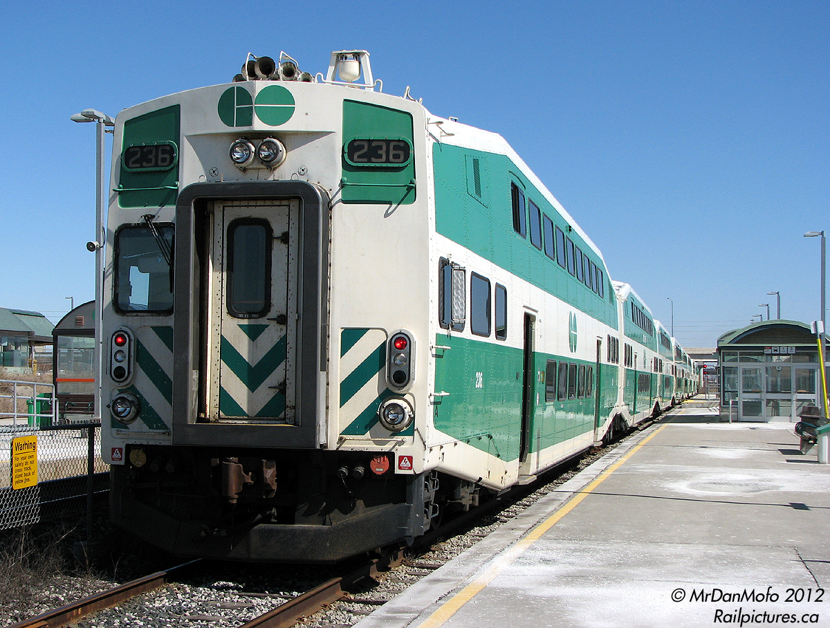 7 minutes before departure and 5 minutes after arriving, GO 236 on the \"Bramalea Flip\" running as #266 waits to depart the commuter pocket track at Bramalea GO Station back to Toronto. 236 is one of the \"ogre eye\" cab cars, what many of GO\'s looked like before refurbishing with a full cab and windows on both sides. Also take note of the generous amount of winter salt on the platforms; typical in the winters around GO Transit property. Alas, the Bramalea Flip has been replaced by buses for a number of years due to Georgetown line construction, and nearly all the ogre eyes have been refurbished.