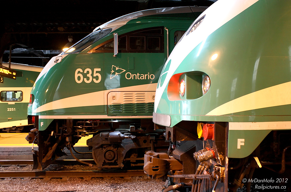 The noses of two GO Transit MPI MP40PH-3C\'s are tucked away under the train shed, waiting for their departure times on tracks 1 & 2 during evening rush hours.