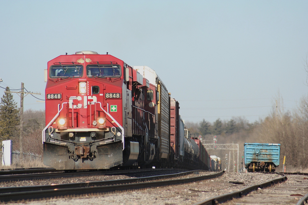 A pair of GEs lead CP train number 424 through Guelph Junction on a warm March afternoon that feels more like May.