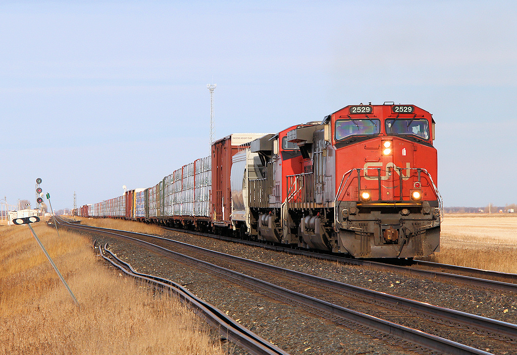 The daily lumber train from Prince George, BC heads for Symington Yard in Winnipeg, Canada