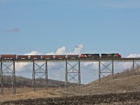 CN L55441 Melville to Sylvite(Rocanville PCS Mine) with IC 1008 after getting a fresh crew heads east. This was the site of a major derailment years ago when a container train was knocked off by a gust of wind.