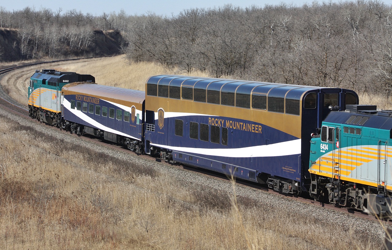 Rocky Mountaineer coaches between two rebuilt F40PH-3\'s on train number one at Rivers Manitoba.