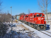 With many miles to go on their 10 MPH journey, a recently overhauled GP38-2 leads two other sisters through Claremont on a beautiful winters morning. 