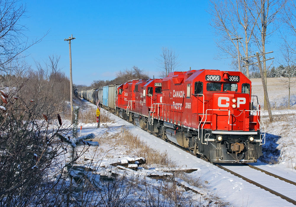 With many miles to go on their 10 MPH journey, a recently overhauled GP38-2 leads two other sisters through Claremont on a beautiful winters morning.