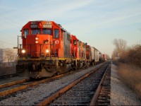 CN 439-06 lead by three older geeps heads up the CASO towards Van de Water yard with 13 cars in tow.