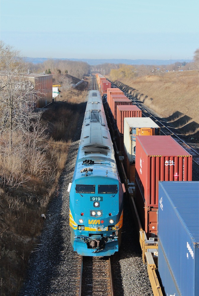 VIA 919 leads train 70 eastbound under Lemonville Road as it races CN 148 on its way to Aldershot Station.