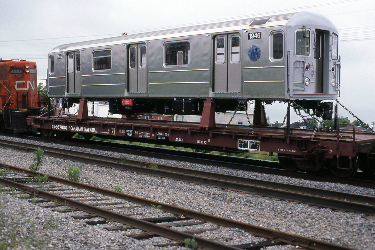 CN 345 with 4298 as 4th loco has 2 NYC subway cars from Bombardier La Pocatière plant to deliver.