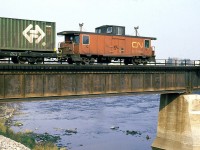 CN 205 crosses the Bécancour river with a long load of containers before the double stack era.
