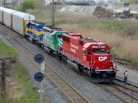 The conductor grabs his train orders as CP train 242 lead by freshly rebuilt ex-SOO 6050 pulls into Walkerville yard.