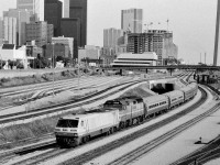 The changing eastward view from Bathurst Street: One of four images showing the changes through years: 1979, 1980's and 2011. The International with LRC 6903 and Amtrak 218 on a Sunday, 1987.  Kodak Tri X Pan b&w negative film. Photographer S. Danko