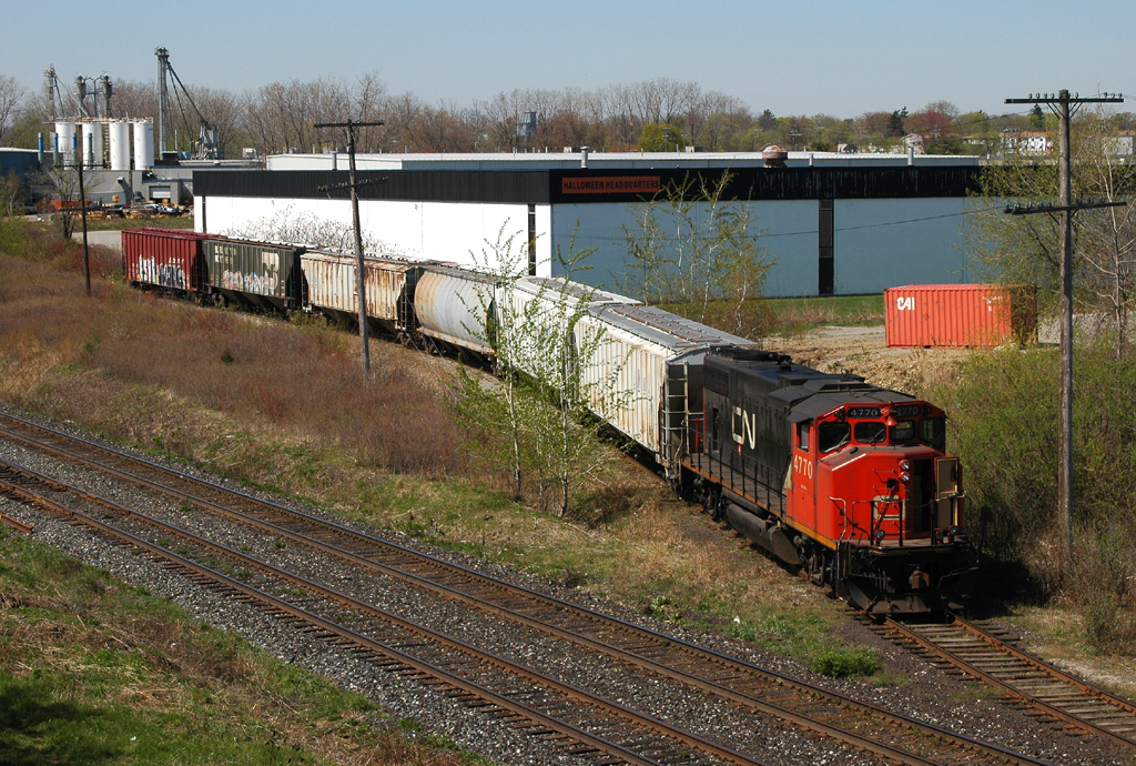 CN 4770 shoving 6 cars uphill to Normerica Inc