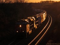 The setting sun glints off CN 2271 and 2129 as they lead 372 on the approach to Port Hope. 1922hrs.