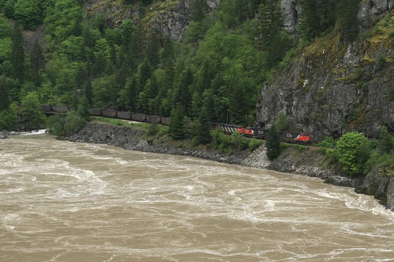 CN coal loads snake along the Fraser river through some pretty rugged terrain near Hells Gate
