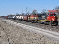 CN 2630 and BCOL 4620 lead train 308 out of the yard in Belleville and through CN Qunity. Work progresses on the construction of the third main track. 1125hrs.