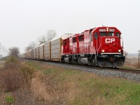 A couple of fresh ex SOO's, CP 6240 and 6260 lead train 242 eastward at the Belle River mile board.