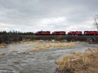 Four different paint schemes lead T08 over the incredibly swollen Majors creek in Green River on April Fools Day 2008.