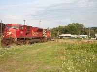 The power for Hamilton-Sudbury train # 231 idles at Aberdeen Yard with the yard office in the background