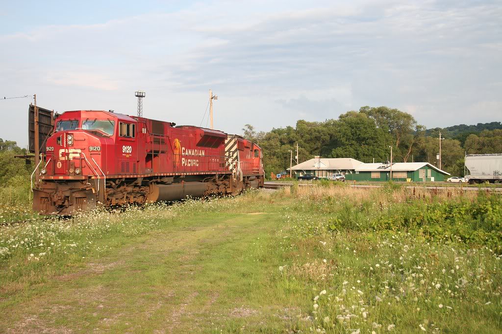 The power for Hamilton-Sudbury train # 231 idles at Aberdeen Yard with the yard office in the background