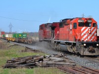 Getting kind of rare these days, an SD40-2 led CP 244 kicks up dust as it charges thru Tilbury headed eastbound.
