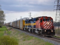 CP 147 led by an all EMD lashup of CP and ICE, heads westbound at mp 71 after just departing from the Ringold Siding.