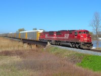 CP 240 led by SOOs 6059 and 6053 pass over the Ruscom River bridge as it heads eastbound at St Joachim.