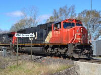 CN 509 led by SD75i # 5736 pulls out of the siding at CN School Road after letting a westbound train pass by