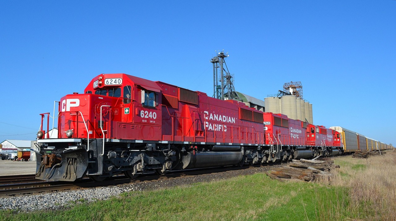 CP 147 led by rebuilt ex SOOs 6240, 6260 & 6254, heads westbound past the grain elevator at Haycroft.