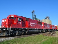 [Editors note: Lens Distortion noted] CP 147 led by rebuilt ex SOOs 6240, 6260 & 6254, heads westbound past the grain elevator at Haycroft. 