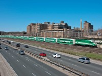 A 12 car midday GO train heads west through Sunnyside with 602 shoving, anyone else spot the second cabcar in the consist ? 