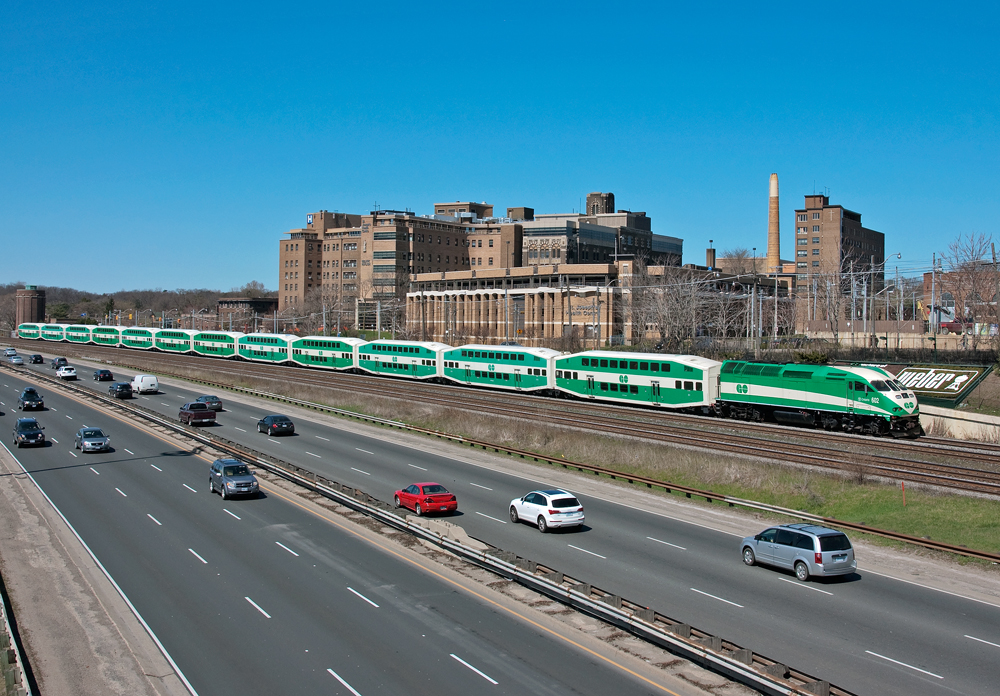 A 12 car midday GO train heads west through Sunnyside with 602 shoving, anyone else spot the second cabcar in the consist ?