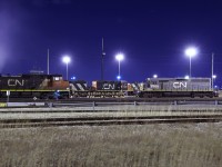 Making a trip down to the engine shops of MacMillan Yard to find by surprise one of the few grey GTW's put in service on CN sitting on the south side of the shops. To the left of it is CN 2571 smoking up.