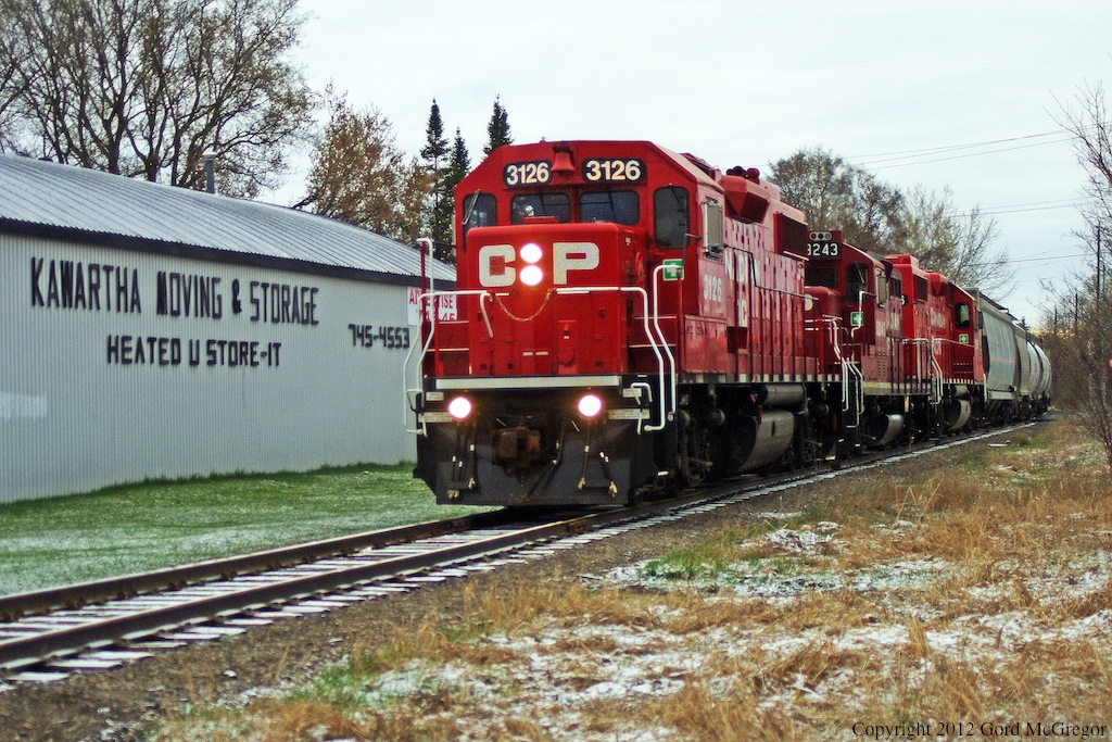 T07 using a GP9 8243 as power with 3126 and 3066 roll silently through Peterborough Ontario.