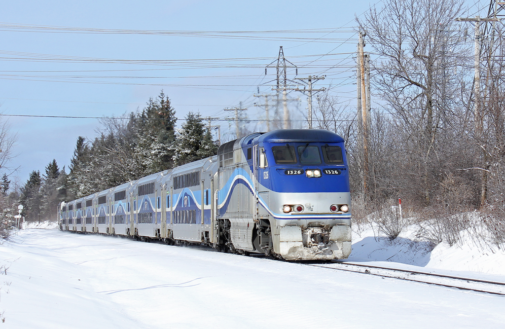 AMT F59PHI with commuter train at St.-Rose stop.