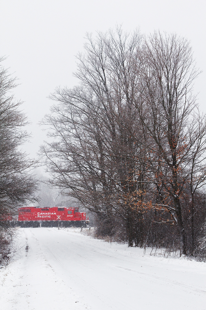 KLR T07-28 mosies through the winter landscape with primarily unimin loads from the mine in Nephton and a handful of hoppers loaded at Quaker Oats in Peterborough.