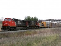 CN 148 powered by CN 2099, IC 2702 and recently repainted slug 223 drag 141 cars up the Halton Sub's ruling grade
