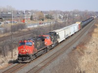 CN Dash-9 & SD75I with mixed freight.
