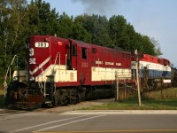 OSR 383 and M420W 646 shove a long cut of empties back into the Petro Canada Lubricants plant at Clarkson after clearing the only grade crossing on the line at Orrs Road.