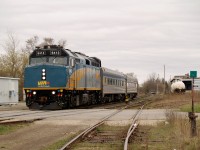 With GEXR 582 in the clear VIA 85 proceeds west through Guelph with VIA 6413 and 2 coaches. 