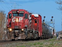 A pair of SD40-2's lead a short westbound transfer from Agincourt Yard to Lambton with traffic for the locals (Emery, Obico and Streetsville) along with interchange traffic for the CN. In the next couple of years this scene like many more will change as SD40-2's like this will be sent south to be rebuilt by EMD into SD30C-ECO's.