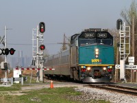 VIA 6404 with Windsor to Toronto train 72 splits the signals at CN Lacasse, mile 99.1 on the Chatham Sub, in Tecumseh.