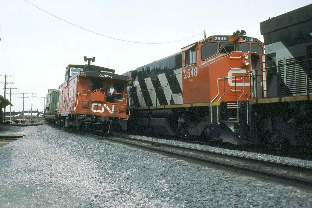 CN 306,s conductor just waved the 345,s crew who,ve just checked his train.