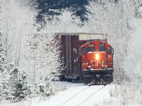 CN 595 Work 4136 pushes boxcars up the hill at Martins into the Panolam facility the morning after a typical Muskoka snowfall.
