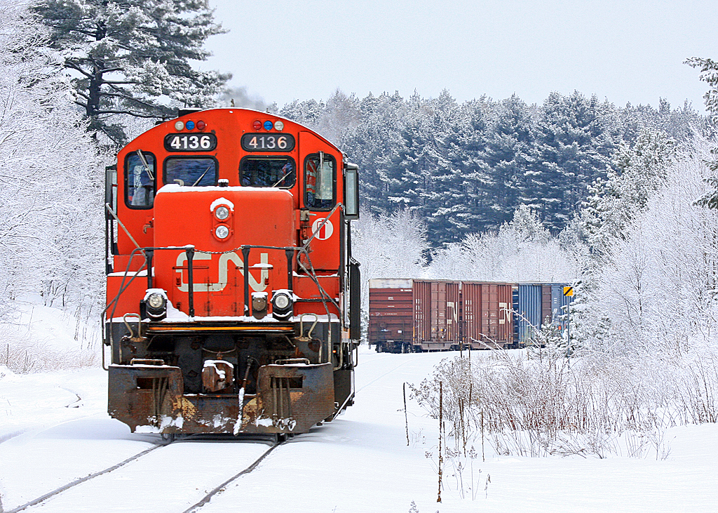 4136 in a typical Muskoka snowscape moving boxcars in and out of the Panolam plant at Martins