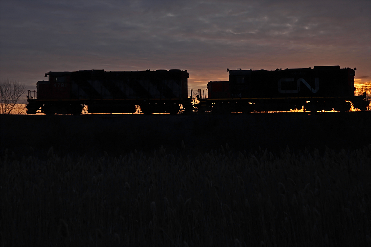 A serene moment as 7022 and 4791 work the Oakville Ford Assembly Plant at sunrise.