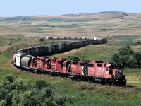 4 GP38-2's head a northbound Mossbank turn down the Missouri Coteau into Moose Jaw on the Expanse Subdivision which connects Assiniboia and the Great Western Railway to the Main Line. 