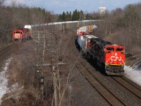 Double Play! As CP 441 slowly creeps towards Lobo to line the switch for the siding, a CN manifest rushes by on the adjacent Strathroy Sub. 